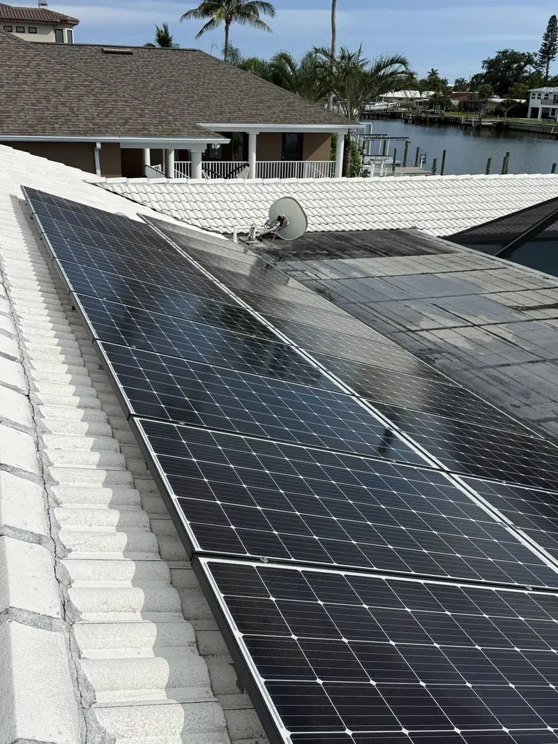Clean solar panels on a waterfront tile roof